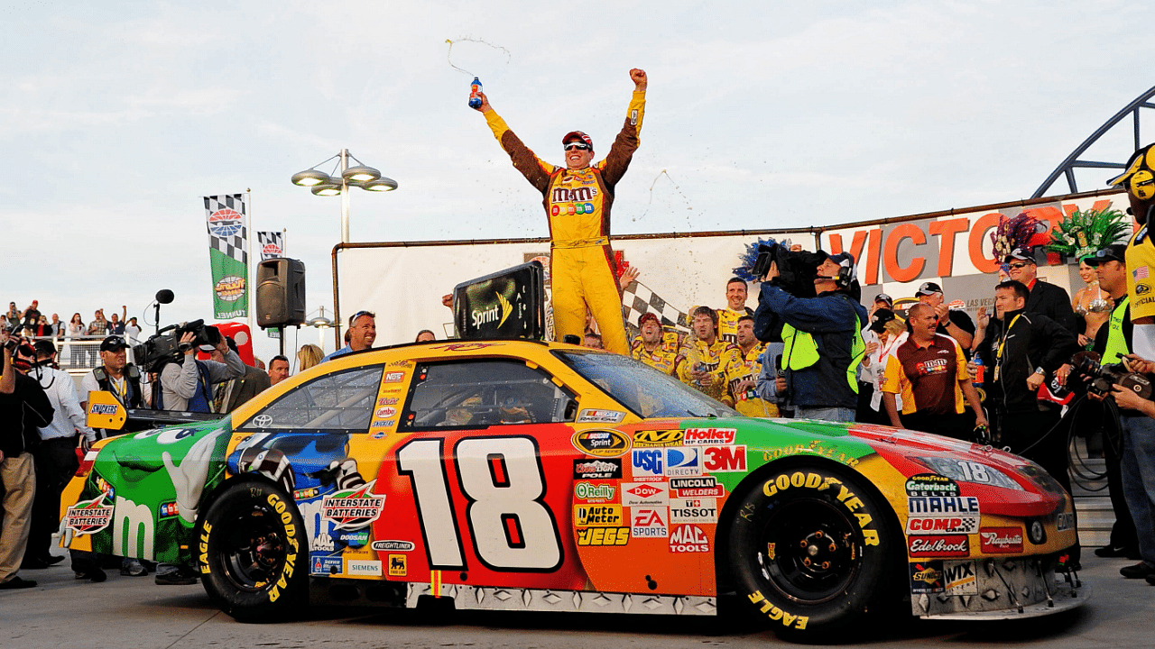 Mar. 1, 2009; Las Vegas, NV, USA; NASCAR Sprint Cup Series driver Kyle Busch celebrates after winning the Shelby 427 at Las Vegas Motor Speedway. Mandatory Credit: Mark J. Rebilas-Imagn Images