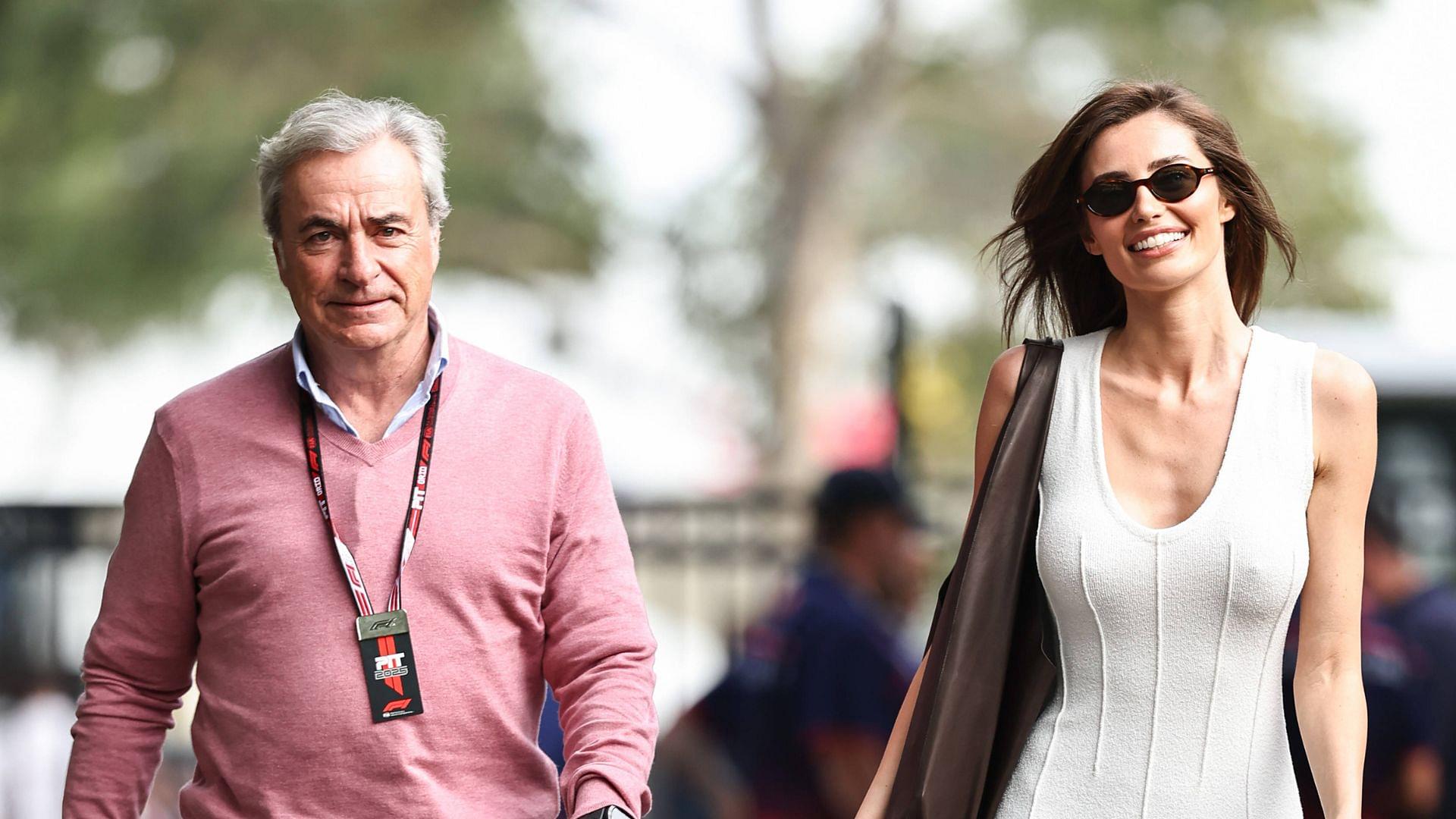 Carlos Sainz Sr. of Spain and Scottish model Rebecca Donaldson attend the Qualifying ahead of the F1 Grand Prix of Australia at Albert Park Circuit in Melbourne