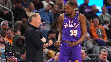 Phoenix Suns head coach Mike Budenholzer talks with Phoenix Suns forward Kevin Durant (35) against the LA Clippers during the second half at PHX Center.