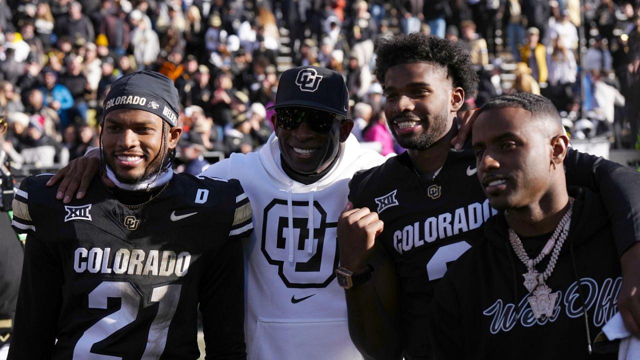 Colorado Buffaloes safety Shilo Sanders (21) and head coach Deion Sanders and quarterback Shedeur Sanders (2) and social media producer Deion Sanders Jr. following the win against the Oklahoma State Cowboys at Folsom Field.