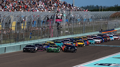 NASCAR Cup Series driver Kyle Busch (8) and NASCAR Cup Series driver Joey Logano (22) lead the field to restart the Straight Talk Wireless 400 at Homestead-Miami Speedway.