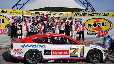 Mar 16, 2025; Las Vegas, Nevada, USA; NASCAR Cup Series driver Josh Berry (21) poses for photos following his victory of the Pennzoil 400 at Las Vegas Motor Speedway. Mandatory Credit: Gary A. Vasquez-Imagn Images