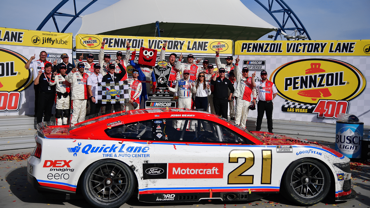 Mar 16, 2025; Las Vegas, Nevada, USA; NASCAR Cup Series driver Josh Berry (21) poses for photos following his victory of the Pennzoil 400 at Las Vegas Motor Speedway. Mandatory Credit: Gary A. Vasquez-Imagn Images