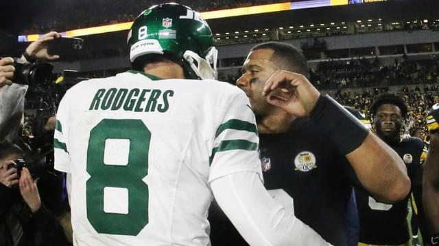 Oct 20, 2024; Pittsburgh, Pennsylvania, USA; New York Jets quarterback Aaron Rodgers (8) and Pittsburgh Steelers quarterback Russell Wilson (right) greet each other after their game at Acrisure Stadium.