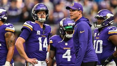 Minnesota Vikings quarterback Sam Darnold (14) and Minnesota Vikings head coach Kevin O'Connell and fullback C.J. Ham (right) look on before the game against the Detroit Lions at U.S. Bank Stadium.