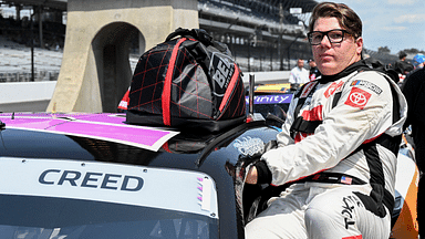 NASCAR Xfinity Series driver Sheldon Creed (18) climbs into his car Saturday, July 20, 2024, during qualifying for the Pennzoil 250 at Indianapolis Motor Speedway.