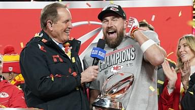 Jan 26, 2025; Kansas City, MO, USA; Kansas City Chiefs tight end Travis Kelce (87) speaks to the media after being presented with the Lamar Hunt Trophy after the AFC Championship game against the Buffalo Bills at GEHA Field at Arrowhead Stadium.