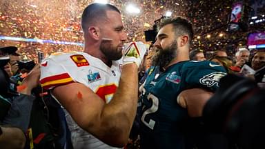 Kansas City Chiefs tight end Travis Kelce (87) talks with his brother Philadelphia Eagles center Jason Kelce (62) after Super Bowl LVII at State Farm Stadium.