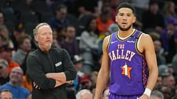 Phoenix Suns head coach Mike Budenholzer looks on alongside Phoenix Suns guard Devin Booker (1) against the Utah Jazz during the first half at Footprint Center.