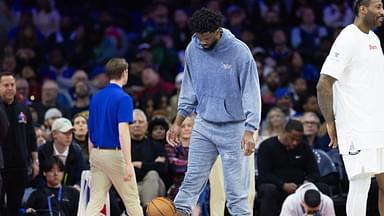 Injured Philadelphia 76ers center Joel Embiid during a timeout in the fourth quarter against the Golden State Warriors at Wells Fargo Center.