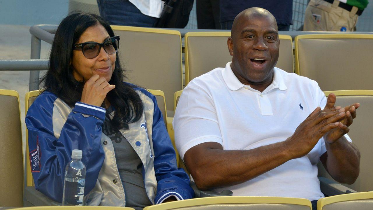 Los Angeles Dodgers partner Magic Johnson (right) and wife Cookie Johnson attend the game against the San Francisco Giants at Dodger Stadium