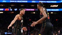 Phoenix Suns guard Devin Booker (1) and Phoenix Suns forward Kevin Durant (35) slap hands against the Cleveland Cavaliers during the second half at Footprint Center.