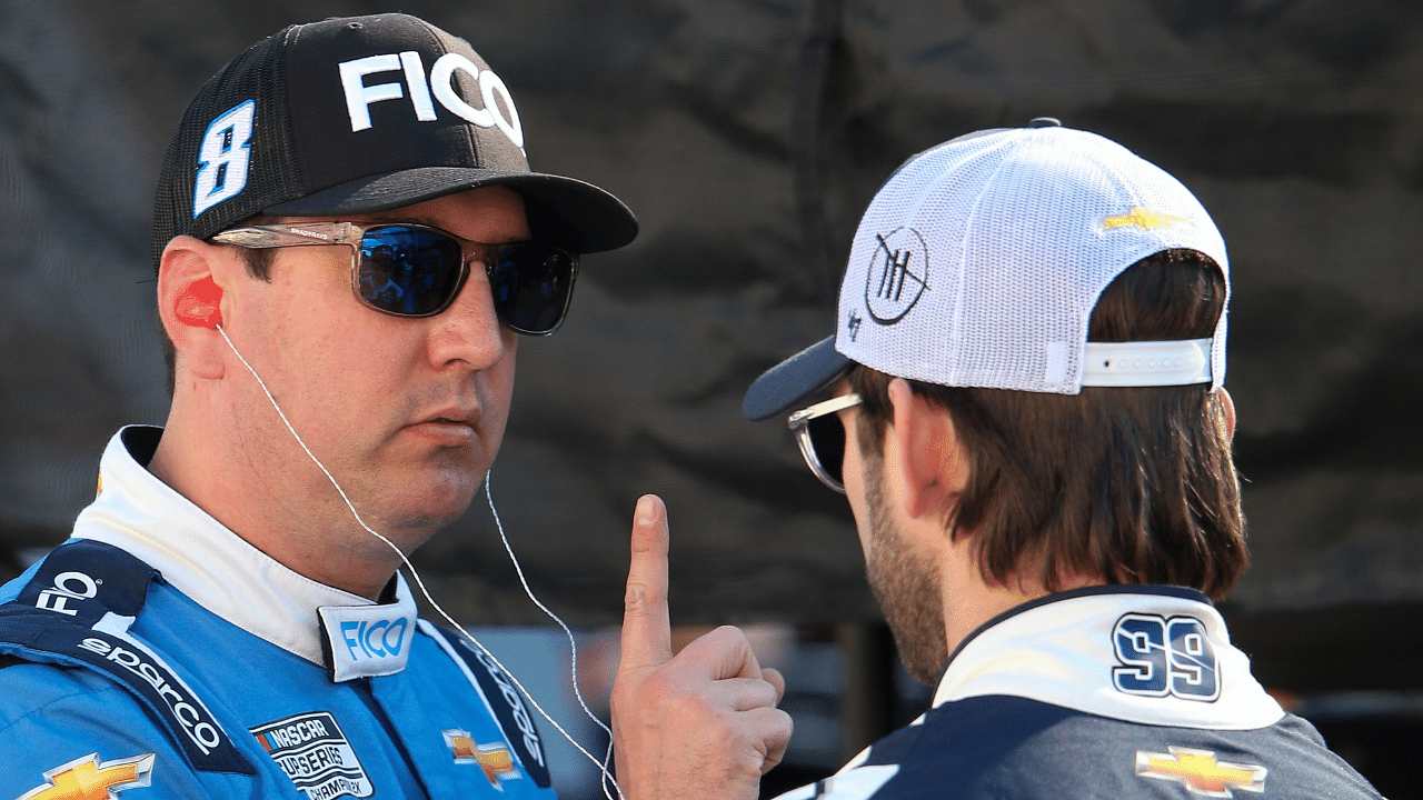 NASCAR Cup Series driver Kyle Busch (8) talks with driver Daniel Suarez (99) before practice for the Food City 500 at Bristol Motor Speedway.