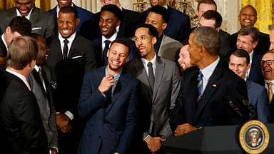 Golden State Warriors guard Stephen Curry (M) laughs with teammates as President Barack Obama speaks during a ceremony honoring the 2015 NBA Champion Warriors in the East Room at the White House