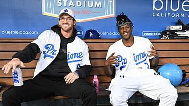 A; American YouTuber Logan Paul and British YouTuber KSI, both cruiserweight professional boxers, pose for photos in the dugout prior to the game between the Los Angeles Dodgers and the Arizona Diamondbacks at Dodger Stadium