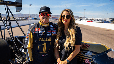 Apr 4, 2024; Chandler, AZ, USA; NHRA top fuel driver Tony Stewart (left) and wife Leah Pruett pose for a portrait prior to the Arizona Nationals at Firebird Motorsports Park. Mandatory Credit: Mark J. Rebilas-Imagn Images