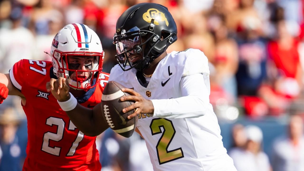 Oct 19, 2024; Tucson, Arizona, USA; Colorado Buffalos quarterback Shedeur Sanders (2) against Arizona Wildcats defensive back Owen Goss (27) at Arizona Stadium.