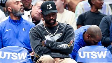 Dallas Mavericks guard Kyrie Irving sits on the bench against the Philadelphia 76ers during the first half at American Airlines Center.