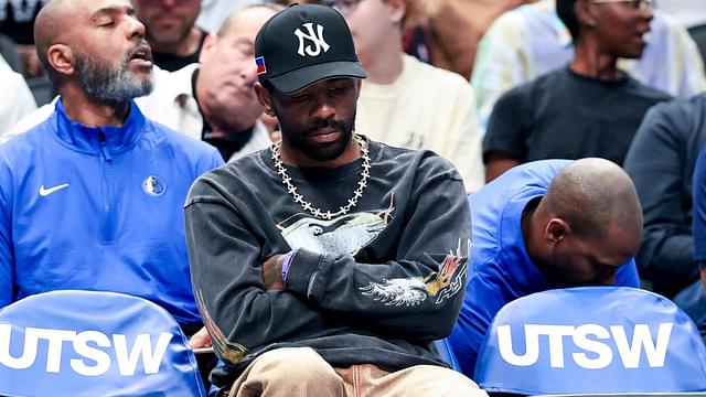 Dallas Mavericks guard Kyrie Irving sits on the bench against the Philadelphia 76ers during the first half at American Airlines Center.