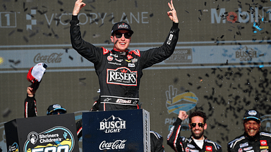 Mar 9, 2025; Avondale, Arizona, USA; NASCAR Cup Series driver Christopher Bell (20) celebrates his victory of the Shriners Children’s 500 at Phoenix Raceway. Mandatory Credit: Gary A. Vasquez-Imagn Images