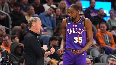 Phoenix Suns head coach Mike Budenholzer talks with Phoenix Suns forward Kevin Durant (35) against the LA Clippers during the second half at PHX Center.