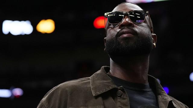 Former Miami Heat player Dwayne Wade walks court-side during the second half of the game between the Miami Heat and the Atlanta Hawks at Kaseya Center.