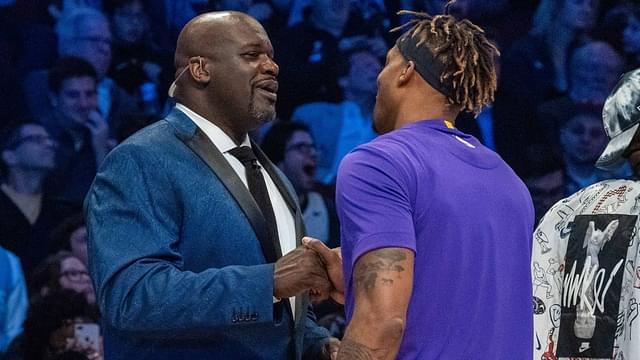NBA great Shaquille O'Neal (left) shakes hands with Los Angeles Lakers player Dwight Howard (right) during NBA All Star Saturday Night at United Center.