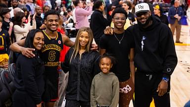 West guard Bronny James (6) poses for a family photo with grandmother Gloria Marie James, mother Savannah James , brother Bryce Maximus James, sister Zhuri Nova James and father LeBron James following the McDonald's All American Boy's high school basketball game at Toyota Center.
