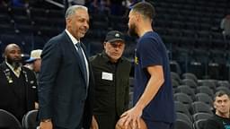 Charlotte Hornets color commentator Dell Curry (left) talks with Golden State Warriors guard Stephen Curry (right) before the game at Chase Center.