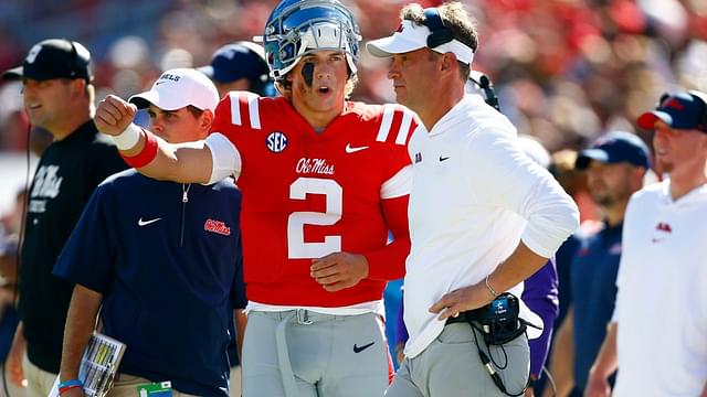 Mississippi Rebels quarterback Jaxson Dart (2) talks with Mississippi Rebels head coach Lane Kiffin during the first half against the Middle Tennessee Blue Raiders at Vaught-Hemingway Stadium.