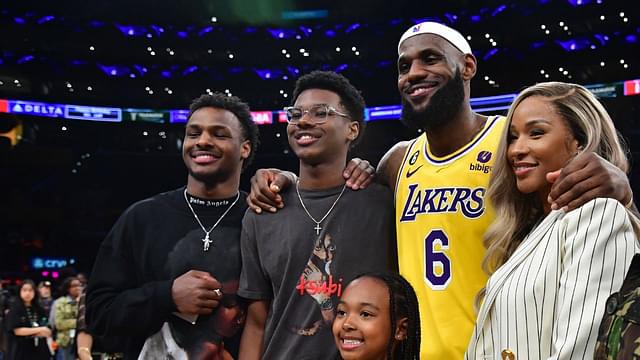 Los Angeles Lakers forward LeBron James (6) poses for photos with his sons Bronny and Bryce Maximus, daughter Zhuri, wife Savannah and mother Gloria after the game against the Oklahoma City Thunder at Crypto.com Arena.