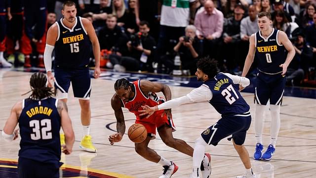 Los Angeles Clippers forward Kawhi Leonard (2) and Denver Nuggets guard Jamal Murray (27) battle for a loose ball in the fourth quarter during game two of first round for the 2025 NBA Playoffs at Ball Arena