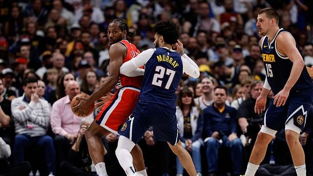 Los Angeles Clippers forward Kawhi Leonard (2) controls the ball as Denver Nuggets guard Jamal Murray (27) guards and center Nikola Jokic (15) defends in the third quarter during game two of first round for the 2025 NBA Playoffs at Ball Arena.