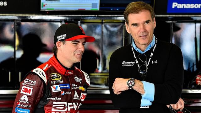 Jeff Gordon talks to with his former crew chief Ray Evernham during practice for the Daytona 500 at Daytona International Speedway.