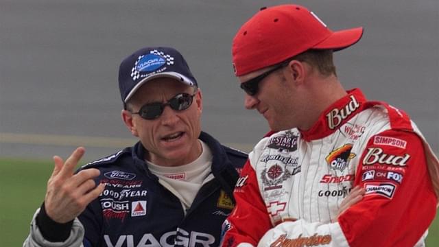 Mark Martin talks with Dale Earnhardt Jr. just before their qualifying runs were called off due to rain Friday afternoon, July 6, 2001 at the Daytona International Speedway.
