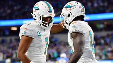 Miami Dolphins wide receiver Tyreek Hill (10) celebrates his touchdown scored against the Los Angeles Chargers with quarterback Tua Tagovailoa (1) during the first half at SoFi Stadium.