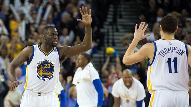 Mar 3, 2016; Oakland, CA, USA; Golden State Warriors forward Draymond Green (23) high fives guard Klay Thompson (11) after a play against the Oklahoma City Thunder during the fourth quarter at Oracle Arena. The Golden State Warriors defeated the Oklahoma City Thunder 121-106. Mandatory Credit: Kelley L Cox-Imagn Images