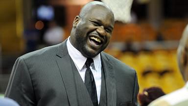TNT analyst Shaquille O'Neal laughs on the court before game four of the Eastern Conference Finals of the NBA Playoffs between the Cleveland Cavaliers and the Atlanta Hawks at Quicken Loans Arena.