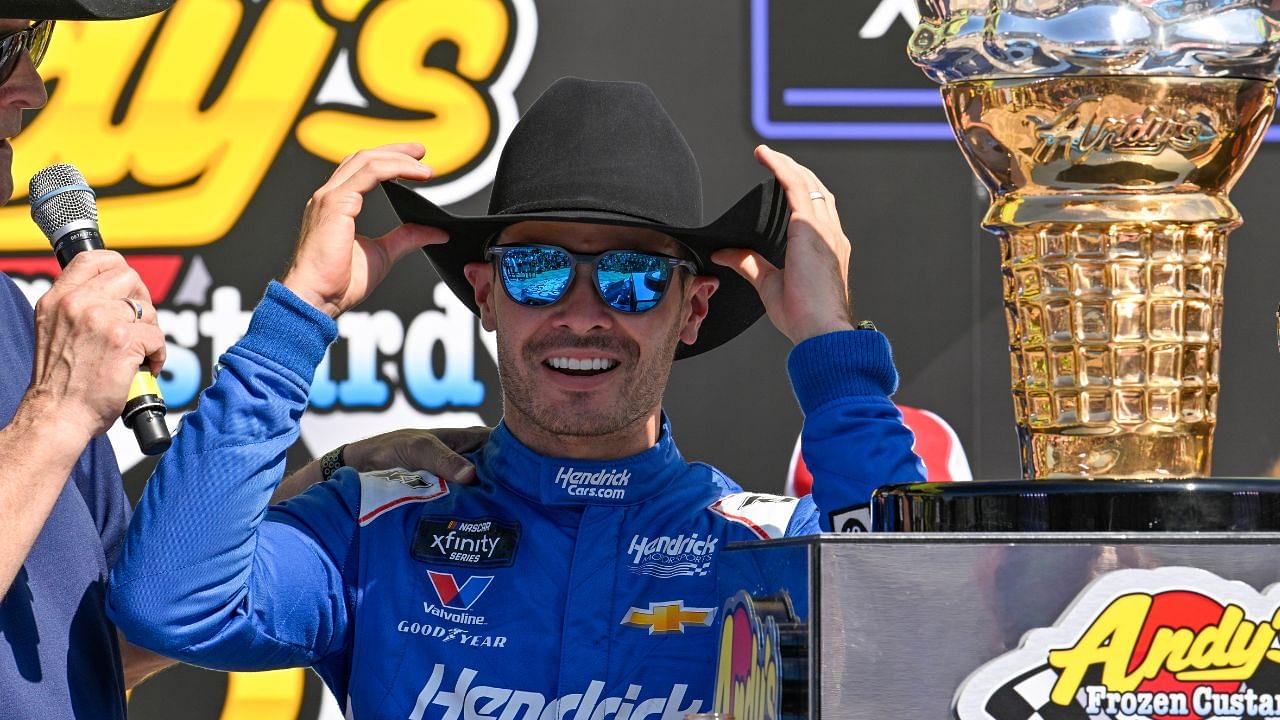 NASCAR Xfinity Series driver Kyle Larson (88) tries on a cowboy hat in Victory Lane after he wins the NASCAR Xfinity race at Texas Motor Speedway.