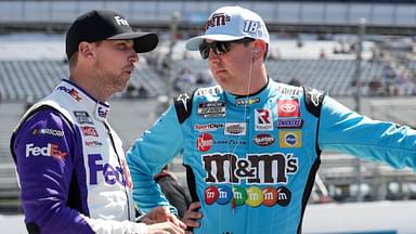 Kyle Busch (right) talks with driver Denny Hamlin (left) on pit road during qualifying for the DuraMAX Drydene 400 at Dover Motor Speedway.