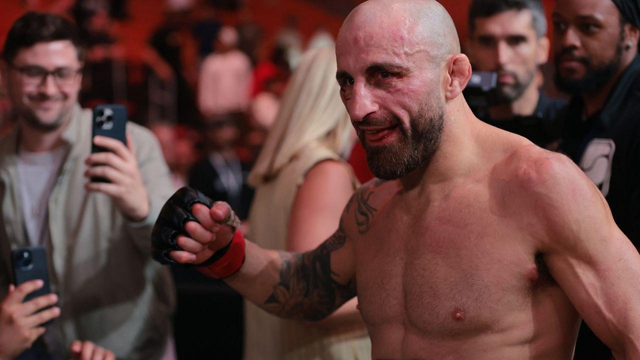 Alexander Volkanovski (red gloves) reacts after defeating Diego Lopes (not pictured) during UFC 314 at Kaseya Center.