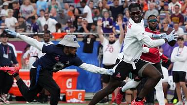 Brian Thomas Jr. of the Jacksonville Jaguars (7) carries the ball against NFC return specialist KaVontae Turpin of the Dallas Cowboys (9) during the 2025 Pro Bowl Games flag football game at Camping World Stadium.