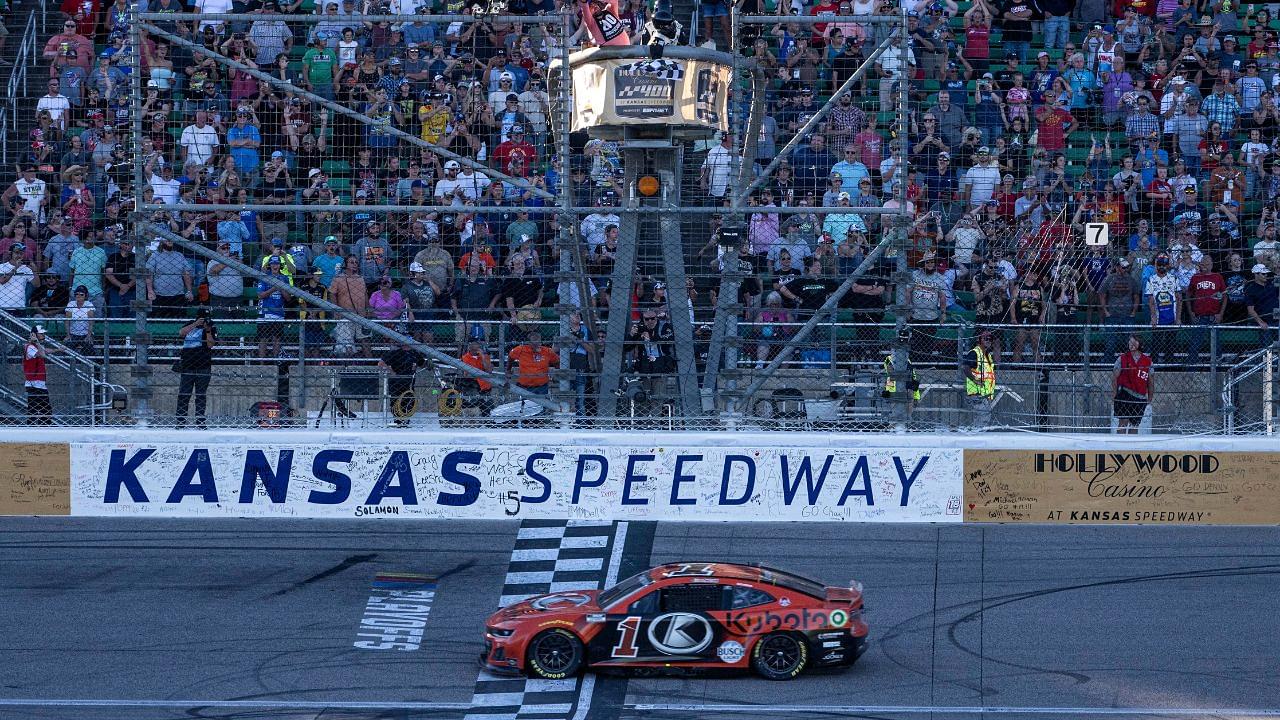 NASCAR Cup Series driver Ross Chastain (1) crosses the finish line to win the Hollywood Casino 400 at Kansas Speedway.