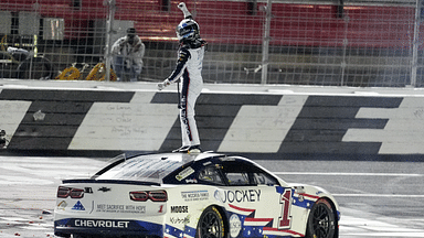 NASCAR Cup Series driver Ross Chastain (1) celebrates his come from behind win with a burnout and tossing a watermelon on the finish line during the Coca Cola 600 at Charlotte Motor Speedway.