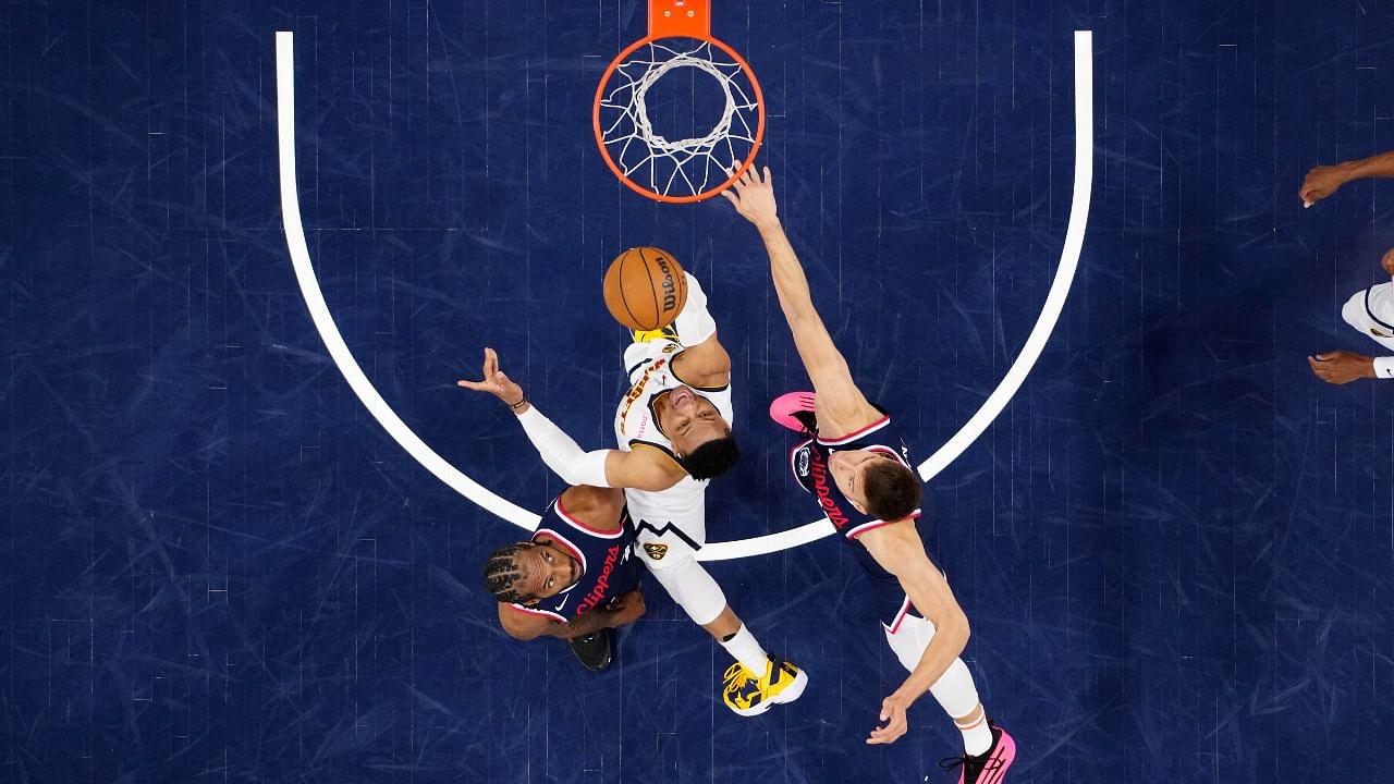 Denver Nuggets guard Russell Westbrook (4) shoots the ball against LA Clippers forward Kawhi Leonard (2) and guard Bogdan Bogdanovic (10) in the second half during game six of first round for the 2025 NBA Playoffs at Intuit Dome.