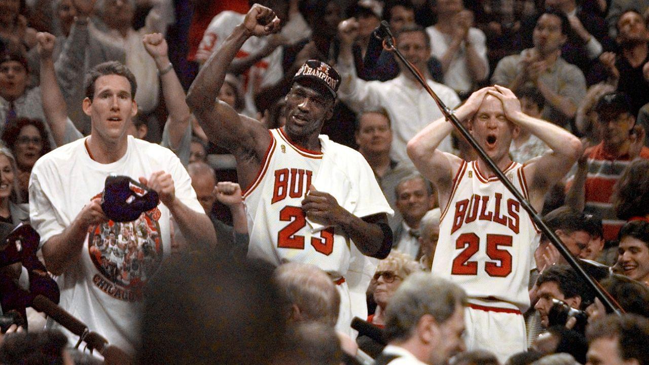 Chicago Bulls players Judd Buechler, left, Michael Jordan, middle, and Steve Kerr celebrate after winning the NBA championship after defeating the Utah Jazz in the 1997 NBA Finals at the United Center.