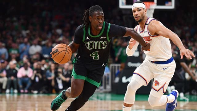 Boston Celtics guard Jrue Holiday (4) controls the ball while New York Knicks guard Josh Hart (3) defends in the second half during game five of the second round for the 2025 NBA Playoffs at TD Garden.