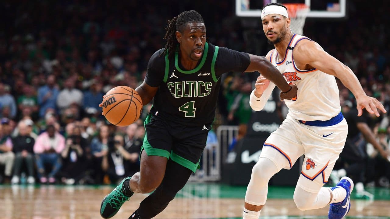 Boston Celtics guard Jrue Holiday (4) controls the ball while New York Knicks guard Josh Hart (3) defends in the second half during game five of the second round for the 2025 NBA Playoffs at TD Garden.