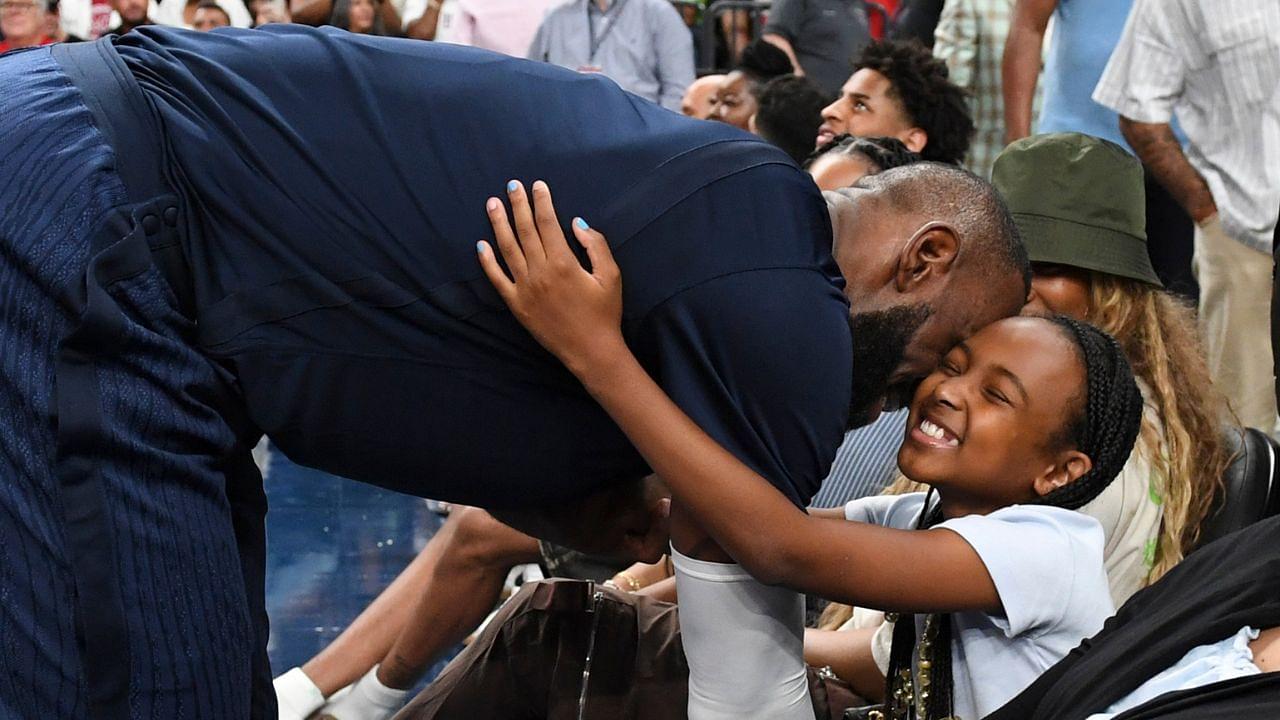 eBron James hugs daughter Zhuri