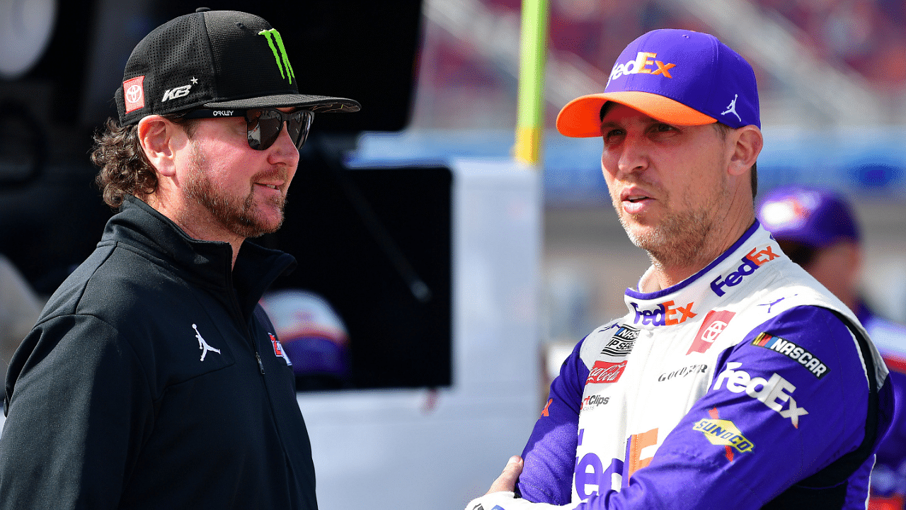 Nov 5, 2022; Avondale, Arizona, USA; NASCAR Cup Series driver Denny Hamlin (11) speaks with Kurt Busch during qualifying at Phoenix Raceway. Mandatory Credit: Gary A. Vasquez-Imagn Images